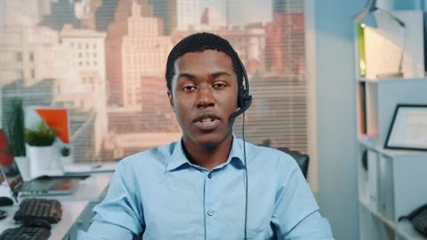 Black customer service operator talking to client in call center Stock Footage 130658365