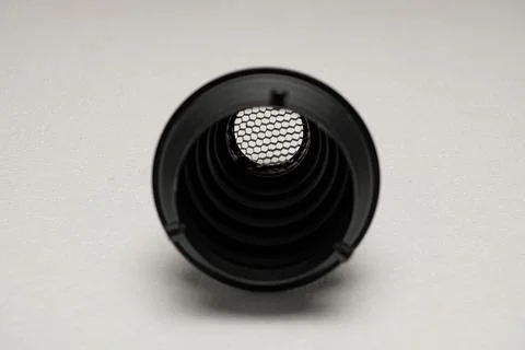 Black cylindrical object with mesh screen Stock Photos