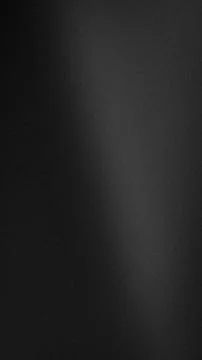 Black dark gray gradient vertical background with grainy texture abstract g.. Stock Photos