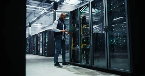 Black Data Center Engineer Using Laptop Computer Stock Footage 320866926