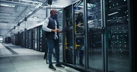 Black Data Center Engineer Using Laptop Computer Stock Footage 320867086