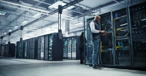 Black Data Center Engineer Using Laptop Computer Stock Footage 320867146