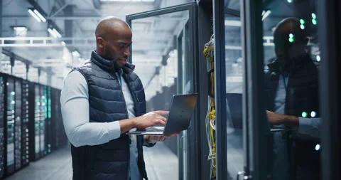 Black Data Center Engineer Using Laptop Computer Stock Footage 320867405