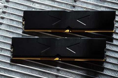 Black DDR5 RAM memory modules placed on a aluminum radiator Stock Photos