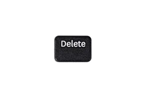 Black delete button on white background close up Stock Photos