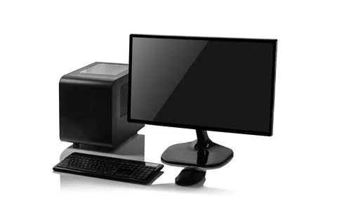 A black desktop computer with a small form factor tower, a flat-screen monitor 库存照片