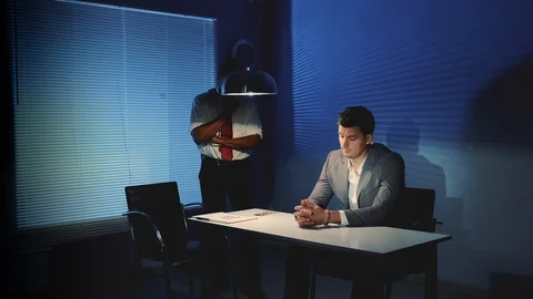 Black detective using force in questioning the accused man while showing a photo Stock-Footage 122922347