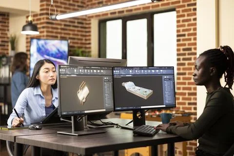 Black developer creating machine parts 스톡 사진