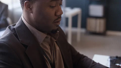 Black Developer Working on Laptop at Desk in Modern Office Stock Footage 334928896