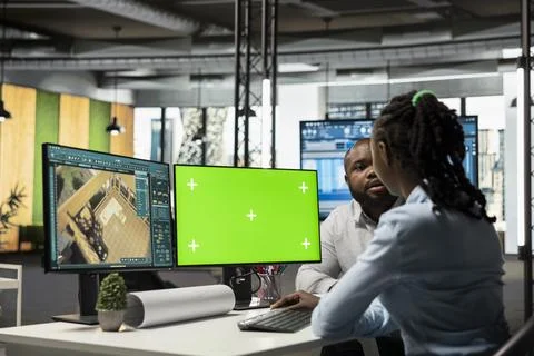 Black developers team preparing apartment building layout next to mockup screen Foto stock