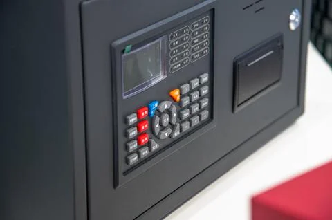 A black device with a screen and buttons. It's a fire safety system, one th.. Stock Photos