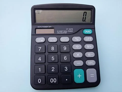 Black Digital Calculator on Light Blue Background Stock Photos