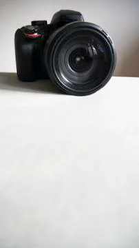 Black digital camera isolated on a light background Stock-Fotos
