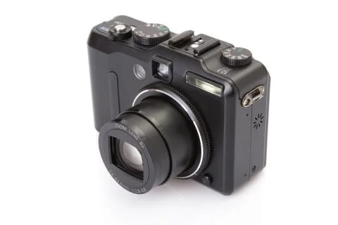 Black digital compact camera isolated on white Stock Photos