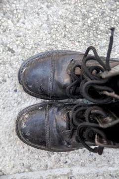 Black dirty boots Stock Photos