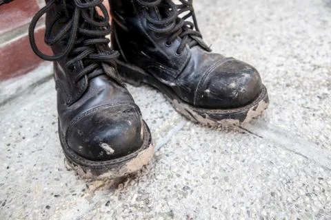 Black dirty boots Stock Photos