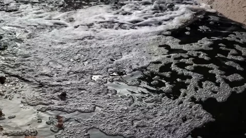 Black dirty flow of gutter water dumping to canal Stock Footage 156934807