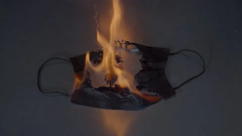 Black Disposable Mask Burning Stock Footage 233077455