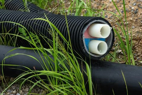 Black district heating pipe for connecting heat pumps. Close up. Stock Photos