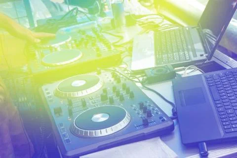 Black dj controller with hands dj , setup with stand laptop. Stock Photos