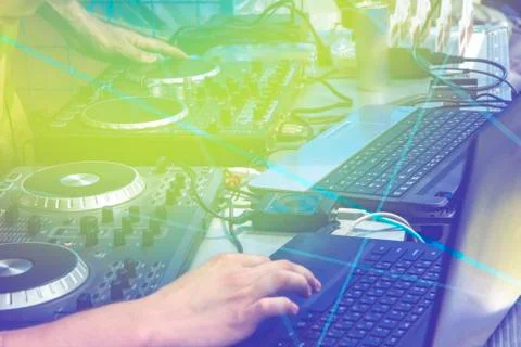 Black dj controller with hands dj , setup with stand laptop. Stock Photos
