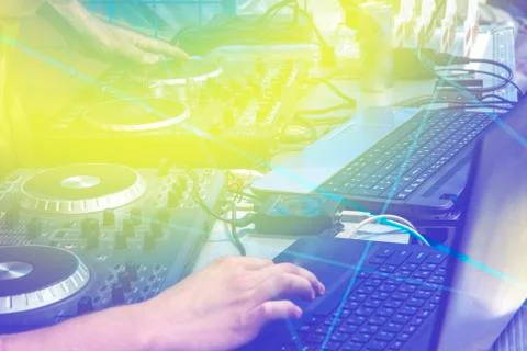 Black dj controller with hands dj , setup with stand laptop. Stock Photos