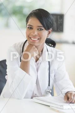 Black Doctor Smiling In Office