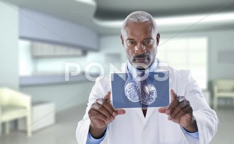 Black Doctor Using Digital Display In Doctor's Office