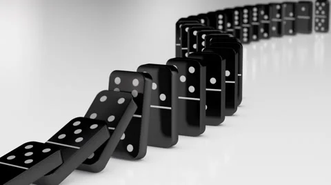 Black Dominoes Falling in Chain Reaction Stock Footage