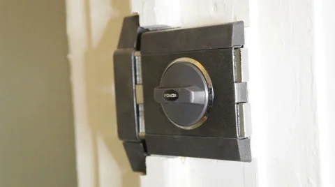 Black door lock open and close Stock Footage 46065837