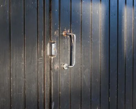 Black door with a lock Stock Photos