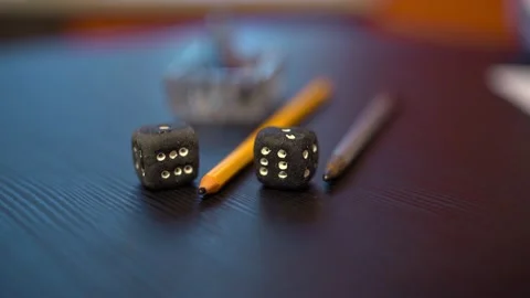 The black dots with white dots are on the table. The hand picks up the cubes. Stock Footage 161261509
