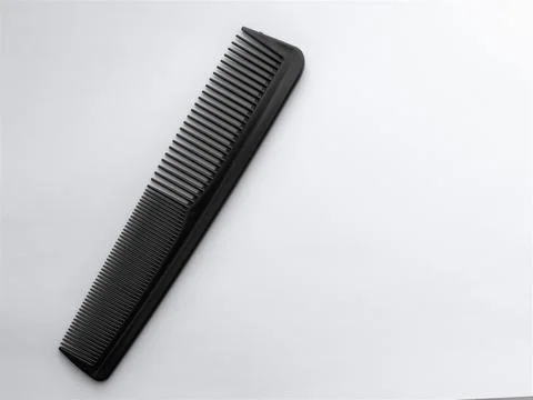 Black double row comb on white background Stock Photos