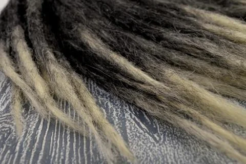 Black dreadlocks with a thin tip at close range Stock Photos