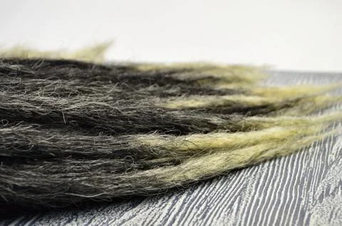 Black dreadlocks with a thin tip at close range Stock Photos