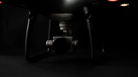 Black drone camera on black background Stock Photos