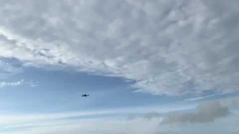 Black Drone Hovering in Cloudy Blue Sky 库存影片 332528075