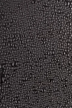 Black drops on surface Stock Photos