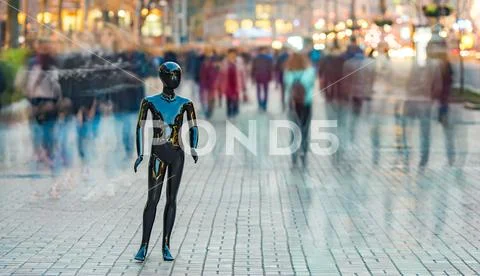 The black dummy standing on the street among the stream of people Stock Photos