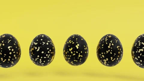 Black Easter eggs with abstract golden patterns on a yellow background Stock Footage 169509855