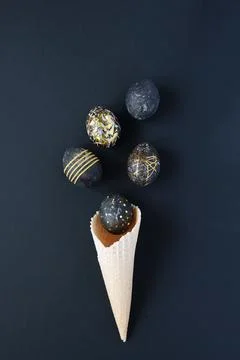 Black easter eggs with gold pattern on black Stock Photos