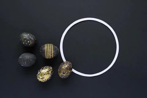 Black easter eggs with gold pattern on black Stock Photos