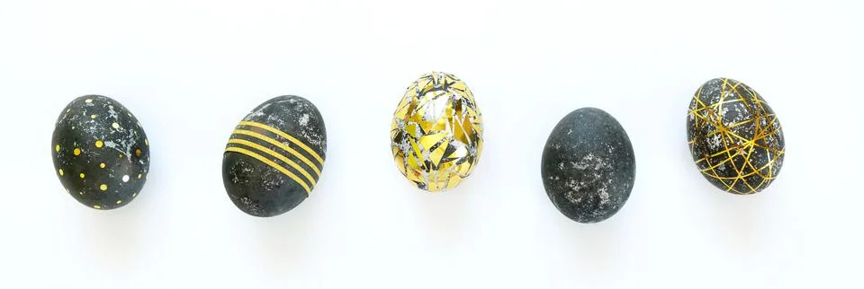 Black easter eggs with gold pattern on white Foto stock