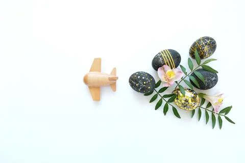 Black easter eggs with gold pattern and pink flowers Stock Photos
