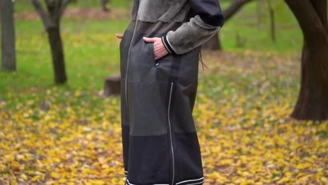 Black eco fur coat on the model. beautiful, high-quality thick fur	 Stock Footage 229872068