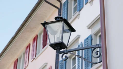 Black electric lantern not in operation during the day, house facade Stock Footage 157217924