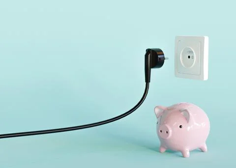 Black electrical plug, electric socket and piggy bank. Ready to connect. Fr.. Stock Photos