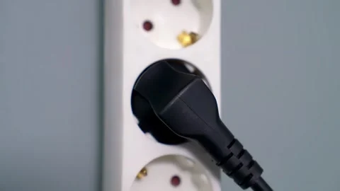 Black Electrical Plug Hand Stock-Footage 273510786