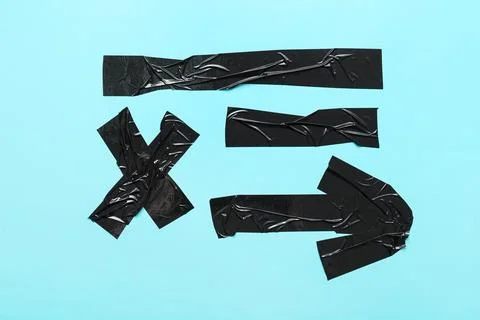 Black electrical tape symbols on blue background: equal sign, multiplication  Stock Photos