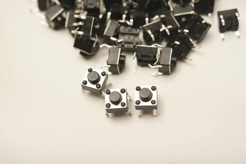 Black electronic buttons on a white background. Electronic elements. Power .. Stock-Fotos